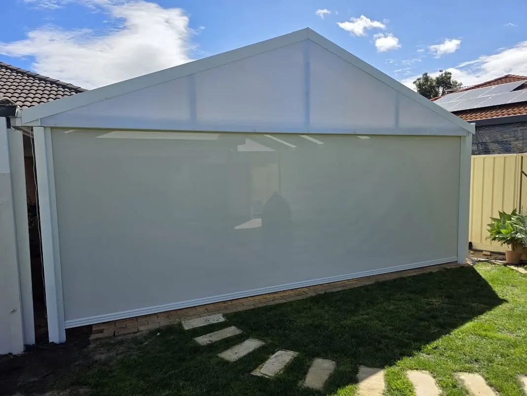White Slidetrack blind closing off a gabled patio