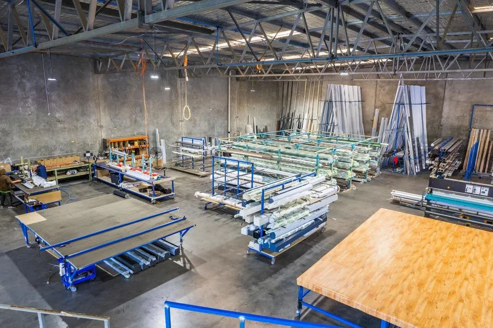Smarter Outdoors factory floor in Wangara seen from the mezzanine, with cutting tables and stock racks